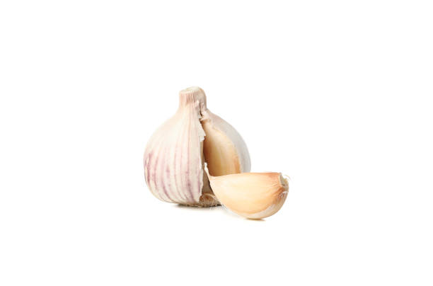 istock Fresh garlic bulb and slice isolated on white background 1202705276