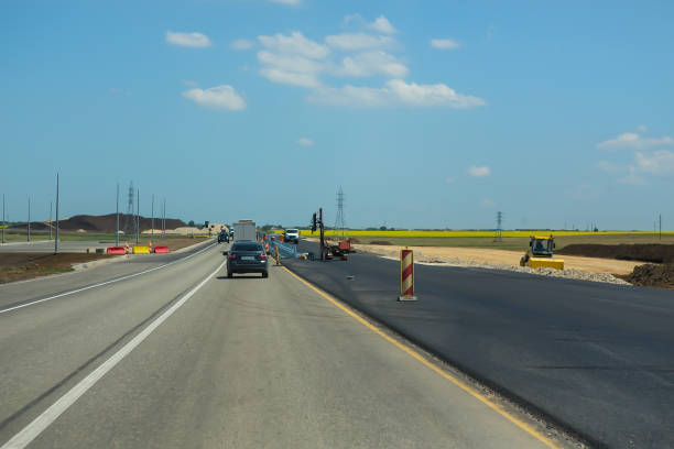 istock Construction of suburban highway 1202709840