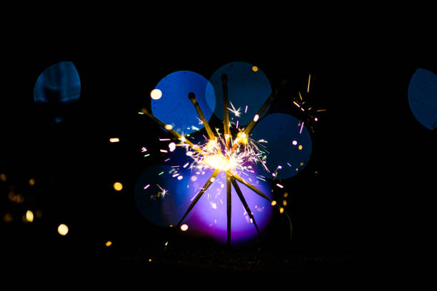 istock Sparks in the dark. Sparks. Christmas and New Year time. Magic light 1202710142