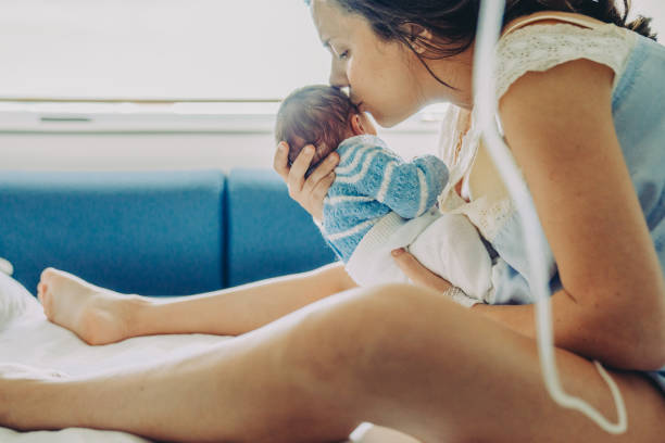 istock Mother with her newborn baby 1202710249