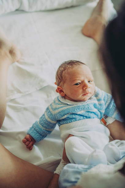 istock Mother with her newborn baby 1202710385
