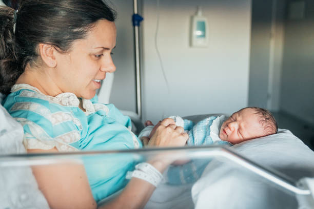 istock Mother with her newborn baby 1202710587