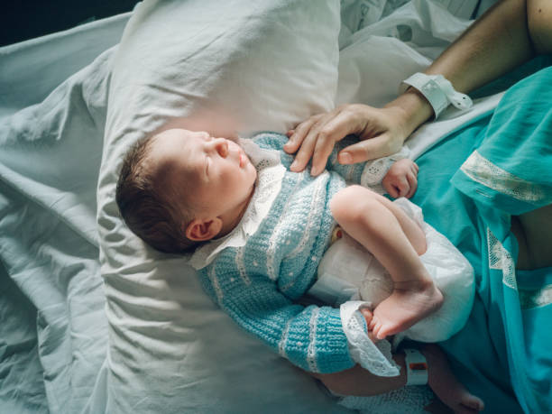 istock Mother with her newborn baby 1202710642