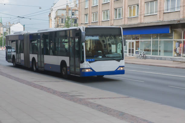 istock city bus moving along the street 1202711005
