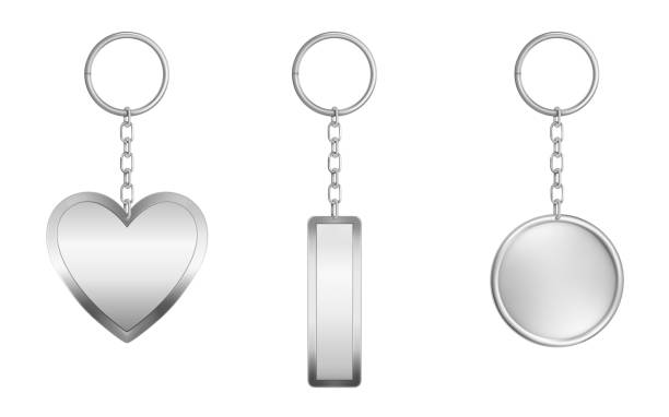 Keychains set. Metal round, rectangular and heart Keychains set. Metal round, rectangular and heart shape keyring holders isolated on white background. Silver colored accessories or souvenir pendants mock up. Realistic 3d vector illustration, icon key ring stock illustrations