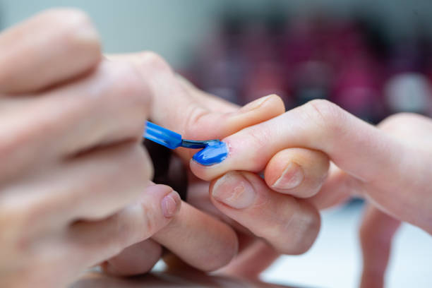 istock Close-up hand painted blue nail 1202712911
