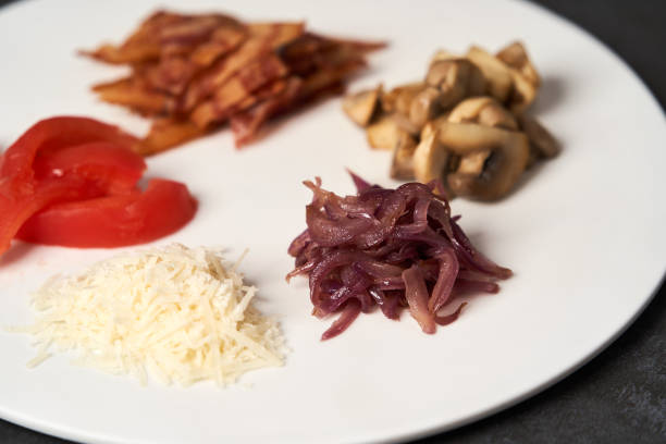 istock Traditional breakfast omelette with bacon, tomatoes, mushrooms, onion 1202713576