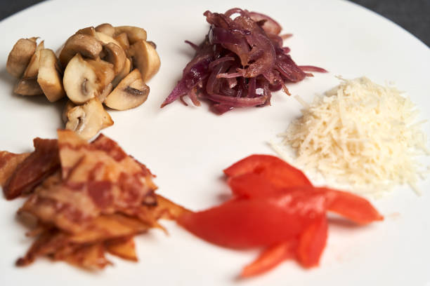 istock Traditional breakfast omelette with bacon, tomatoes, mushrooms, onion 1202713577