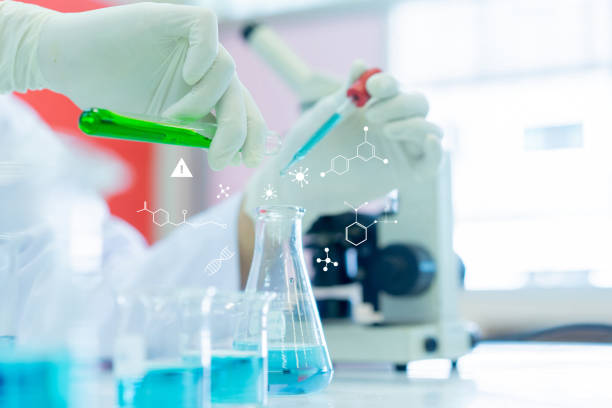 istock close up scientist using test tube to pouring into flask to blending liquid solution (with chemistry icon) to research and experiment and development about anti-virus pharmaceutical at laboratory center 1202717315