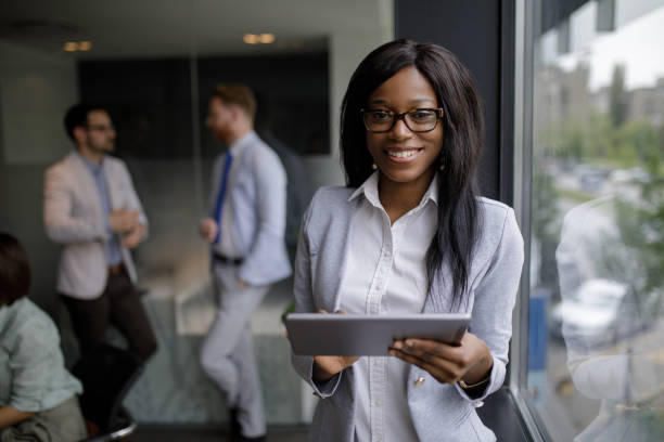 istock Young businesswoman using digital tablet in the office 1202717469