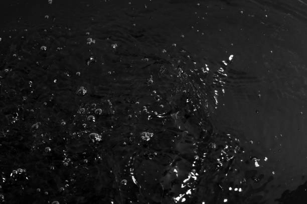 istock texture of water on black background, Water in night time 1202718087
