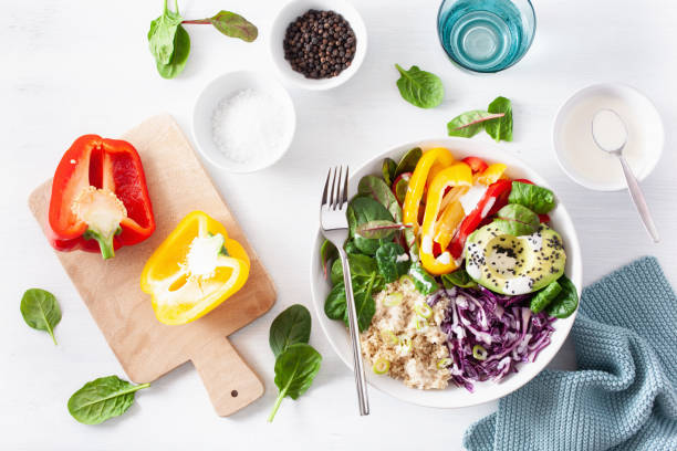 istock veggie couscous lunch bowl with avocado, bell peppers, spinach and red cabbage 1202718850
