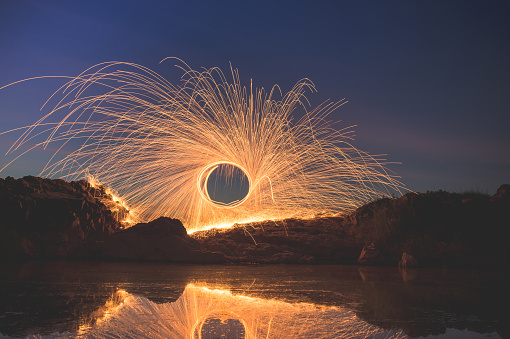 Swing burning steel wool at Sam Pan Bok Sampanbok Ubon Ratchathani Grand Canyon in Thailand, 3000 Boke nature of rock is unseen in Thailand landscape