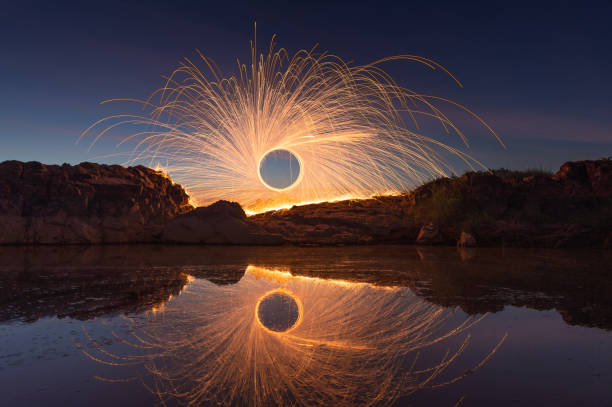 Swing burning steel wool at Sam Pan Bok Sampanbok Ubon Ratchathani Grand Canyon in Thailand, 3000 Boke nature of rock is unseen in Thailand landscape