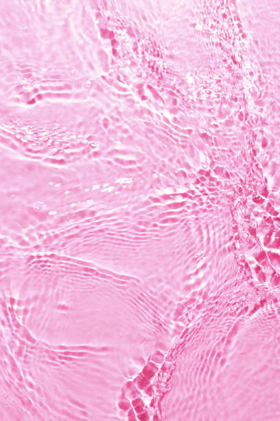istock texture of splashing clean water on pink background 1202721066