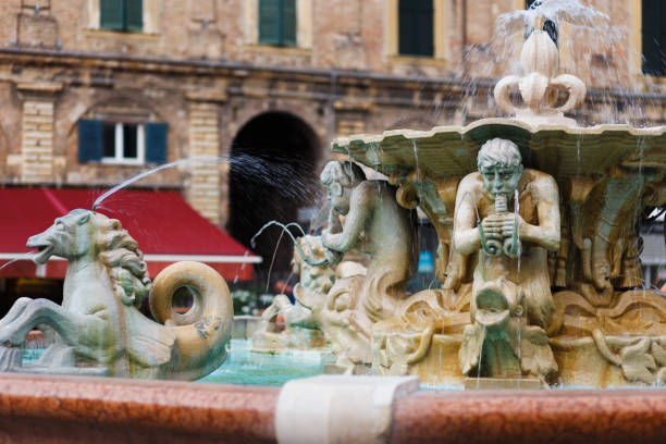 Fountain with lions in Pesaro, Italy. Fountain with lions in Pesaro, Italy. Piazza del popolo marche italy photos stock pictures, royalty-free photos & images
