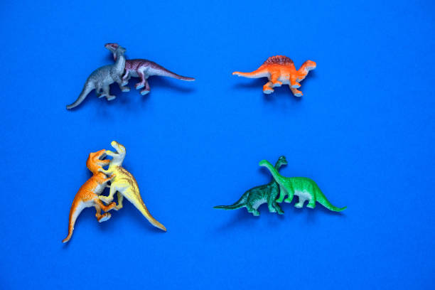 istock small plastic dinosaurs couples and one lonely dinosaur 1202723601