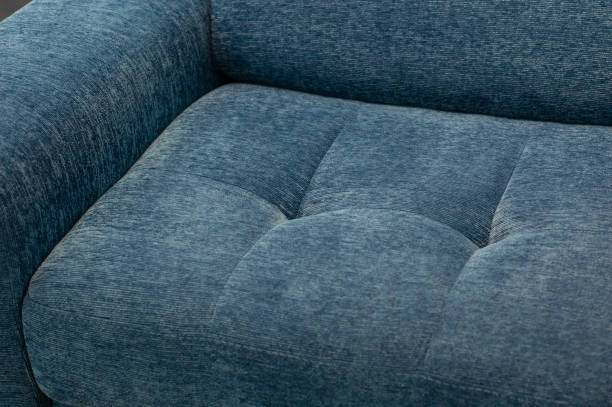 istock Coach-type velours screed tightened with buttons. Chesterfield style quilted upholstery backdrop close up 1202724519