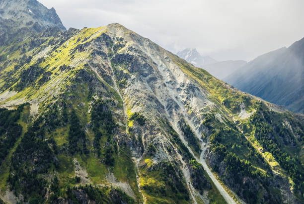 istock green mount top in a mist 1202724773