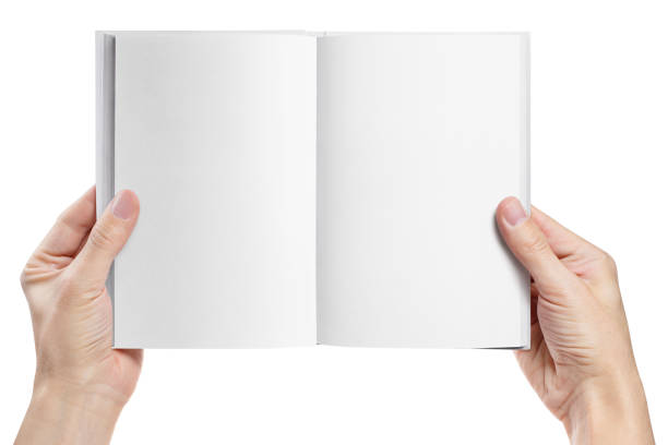 istock Hands holding an open book with blank pages on white 1202724800