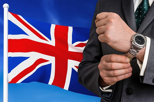 Business in United Kingdom. Businessman on national flag background.
