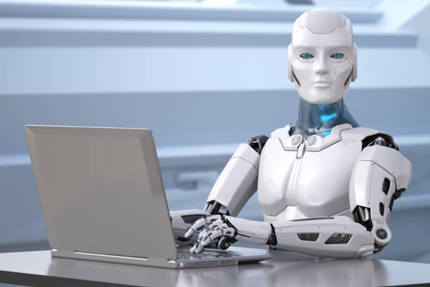 istock The robot works with a laptop 1202728165