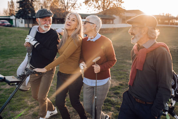 istock Happy seniors gathering to play golf 1202728529