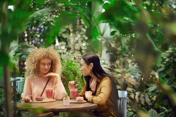 istock Two friends spending time in cafe 1202728585