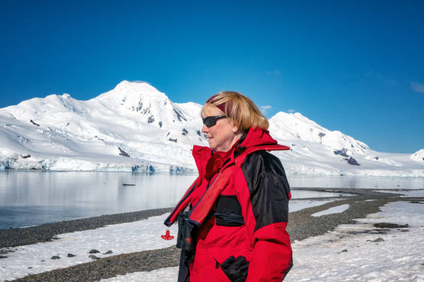 istock Single woman exploring the Antarctic peninsula 1202728721