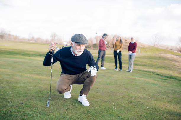 istock Senior man looking his golf shot 1202729476