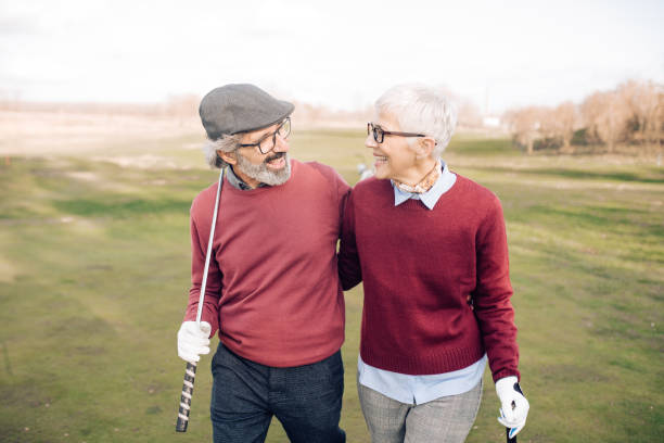 istock Senior couple enjoying together playing golf 1202729481