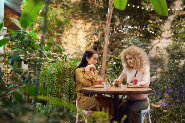 istock Two friends have a meeting in cafe 1202729532