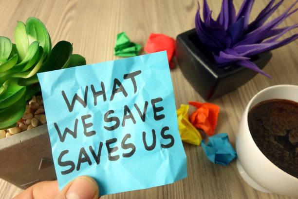 istock Slogan what we save saves us handwritten on sticky note 1202729553