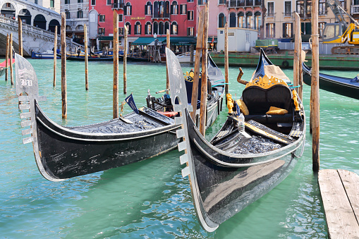 Venice, Italy - March 5, 2015: Two beautiful gondolas in front of famous Rialto Bridge