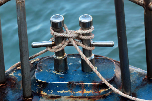 istock Old metal bollard with mooring rope 1202729982