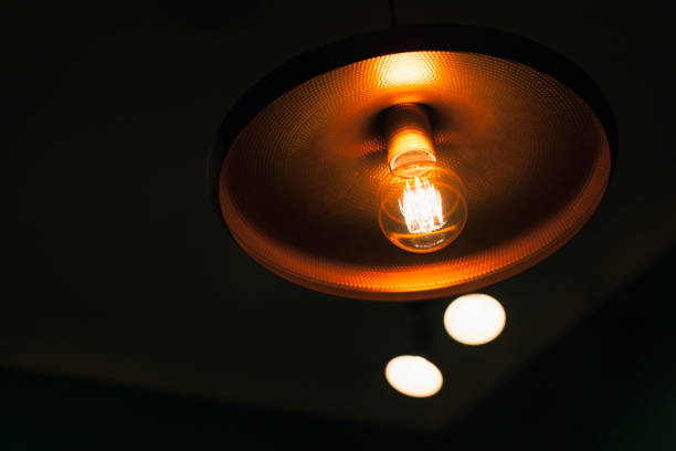 istock Vintage tungsten lamp in a shiny copper lampshade 1202730313