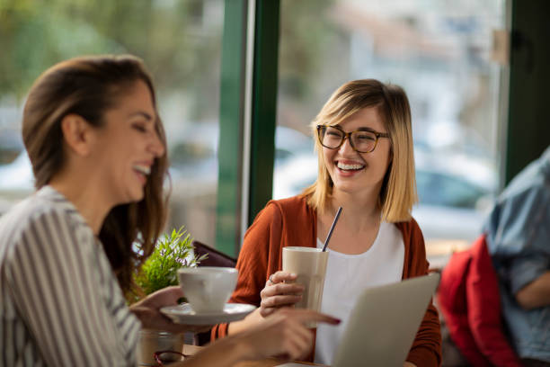 istock Small talk with a friend during coffee break 1202731101