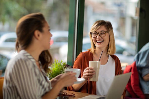 istock Small talk with a friend during coffee break 1202731102