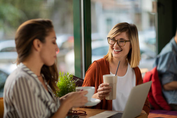 istock Small talk with a friend during coffee break 1202731106