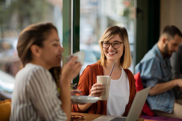 istock Female friends in a cafe having a break 1202731108