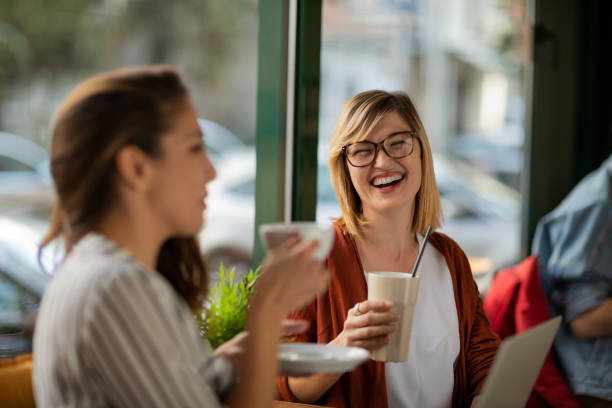 istock Female friends in a cafe having a break 1202731110