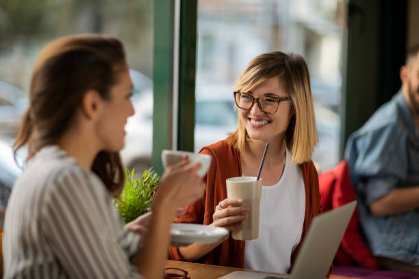 istock Female friends in a cafe having a break 1202731113
