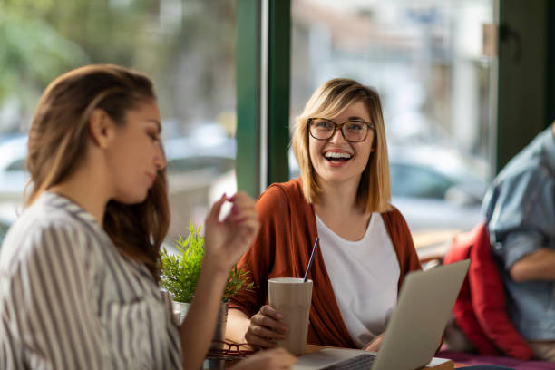 istock Group of young professionals in cafe having a break 1202731129
