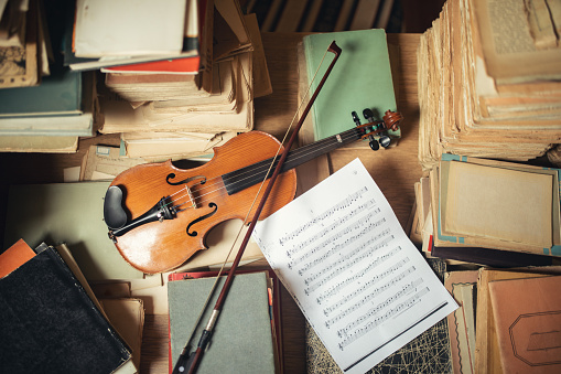 Vintage library still life with violin