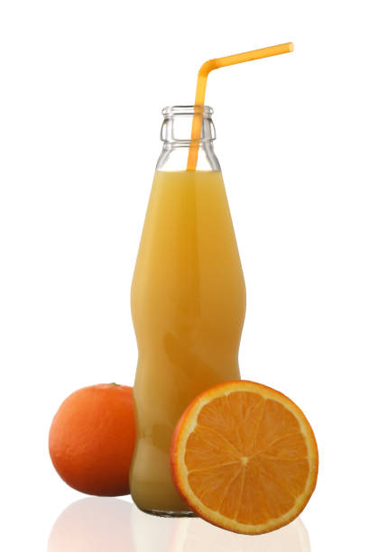 istock Orange juice in bottle and orange fruit isolated on white background 1202732797