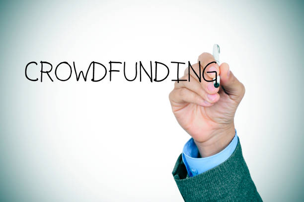 istock man writing the word crowdfunding 1202733895