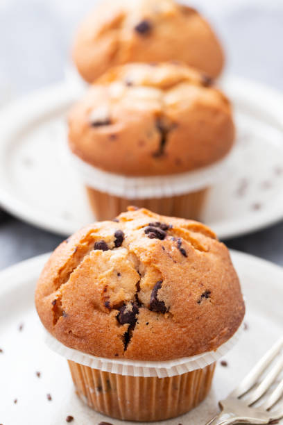 istock muffins with chocolate on white dish on ceramic background 1202739770