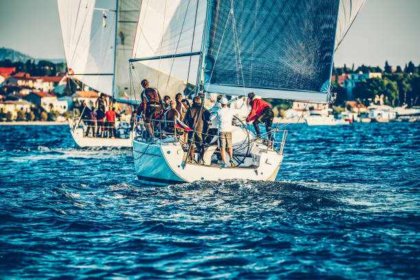 istock Sailing crews on sailboats on regatta 1202743841