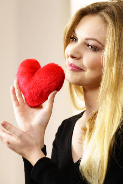 istock Woman holding red heart 1202744248