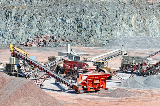 Stone crusher and conveyor belt sorting rock material. quarry. mining industry. stock photo
